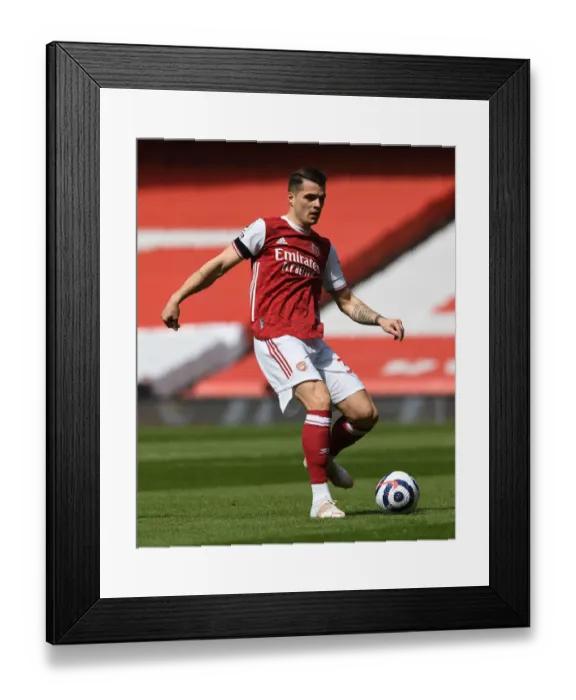 Framed Print : Arsenal's Granit Xhaka in Action at Empty Emirates: Arsenal vs Fulham (April 2021) Framed Print : Arsenal's Granit Xhaka in Action at Empty Emirates: Arsenal vs Fulham (April 2021)