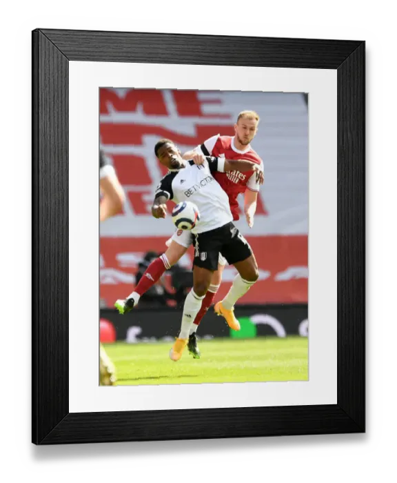Framed Print : Rob Holding vs. Ivan Cavaleiro: Intense Clash at Empty Emirates in Arsenal's Premier League Battle with Fulham, 2020-21 Framed Print : Rob Holding vs. Ivan Cavaleiro: Intense Clash at Empty Emirates in Arsenal's Premier League Battle with Fulham, 2020-21