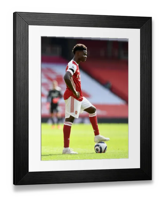 Framed Print : Arsenal's Bukayo Saka in Action against Fulham at Emptied Emirates Stadium (April 2021) Framed Print : Arsenal's Bukayo Saka in Action against Fulham at Emptied Emirates Stadium (April 2021)