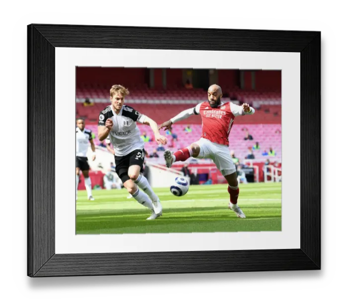 Framed Print : Arsenal vs Fulham: Lacazette Faces Off Against Anderson Amid Empty Emirates Stadium (April 2021) Framed Print : Arsenal vs Fulham: Lacazette Faces Off Against Anderson Amid Empty Emirates Stadium (April 2021)