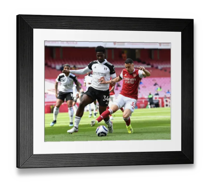 Framed Print : Arsenal vs. Fulham: Martinelli Faces Off Against Aina in Empty Emirates Stadium, Premier League 2020-21 Framed Print : Arsenal vs. Fulham: Martinelli Faces Off Against Aina in Empty Emirates Stadium, Premier League 2020-21
