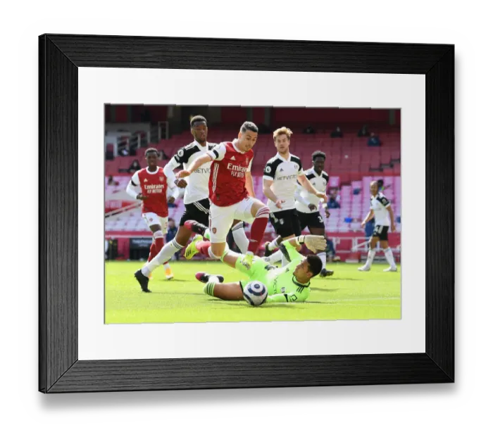 Framed Print : Arsenal's Martinelli Faces Off Against Fulham's Areola in Empty Emirates Stadium