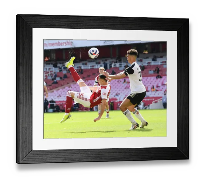 Framed Print : Arsenal's Martinelli Goes for Bicycle Kick Against Fulham in Empty Emirates Stadium