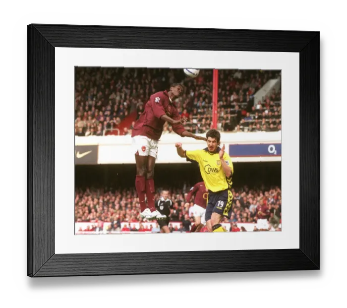 Framed Print : Emmanuel Adebayor's Thrilling Debut Goal: Arsenal Crushes Aston Villa 5-0