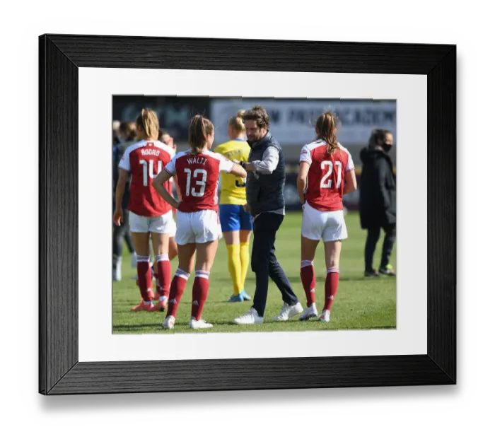 Framed Print : Arsenal Women's Victory: Montemurro Fists Bump Jubilant Player Amidst Empty Stands vs. Brighton & Hove Albion (FA WSL, 2021)
