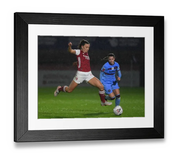 Framed Print : Arsenal's Katie McCabe Battles for Possession in Empty FA WSL Match Against West Ham United