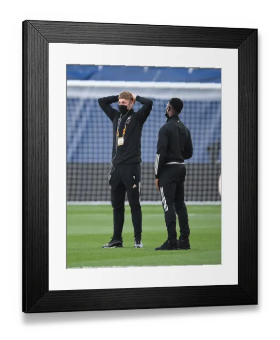Framed Print : Arsenal's Smith Rowe and Nketiah Prepare for Villarreal Semi-Final Amid Empty Stands Framed Print : Arsenal's Smith Rowe and Nketiah Prepare for Villarreal Semi-Final Amid Empty Stands