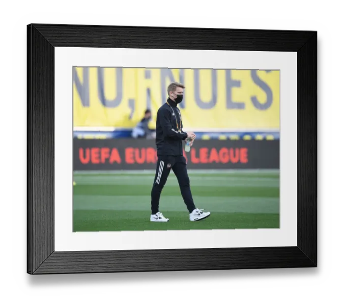 Framed Print : Arsenal's Martin Odegaard Prepares for Villarreal Showdown in Empty Europa League Semi-Final Stadium Framed Print : Arsenal's Martin Odegaard Prepares for Villarreal Showdown in Empty Europa League Semi-Final Stadium
