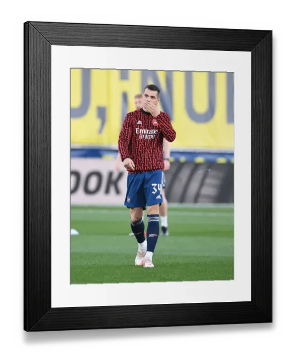 Framed Print : Granit Xhaka at Empty Estadio de la Ceramica: Arsenal's Europa League Semi-Final Battle with Villarreal Amid COVID-19 Restrictions Framed Print : Granit Xhaka at Empty Estadio de la Ceramica: Arsenal's Europa League Semi-Final Battle with Villarreal Amid COVID-19 Restrictions