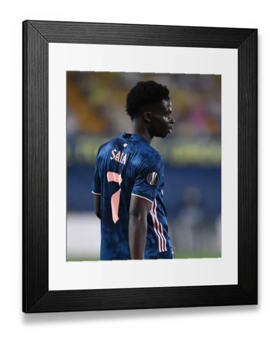 Framed Print : Bukayo Saka in Action: Arsenal vs. Villarreal, UEFA Europa League Semi-Final Leg One (Behind Closed Doors)