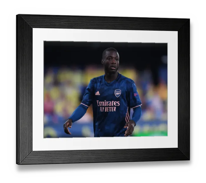 Framed Print : Arsenal's Nicolas Pepe in Action: UEFA Europa League Semi-Final vs Villarreal Amidst Empty Stands Framed Print : Arsenal's Nicolas Pepe in Action: UEFA Europa League Semi-Final vs Villarreal Amidst Empty Stands