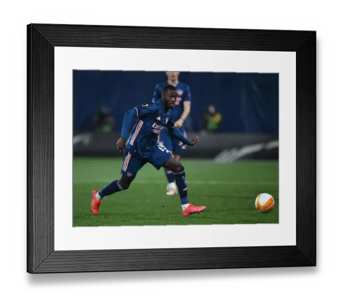 Framed Print : Arsenal's Nicolas Pepe in Action: UEFA Europa League Semi-Final vs Villarreal (2020-21) - Empty Estadio de la Ceramica