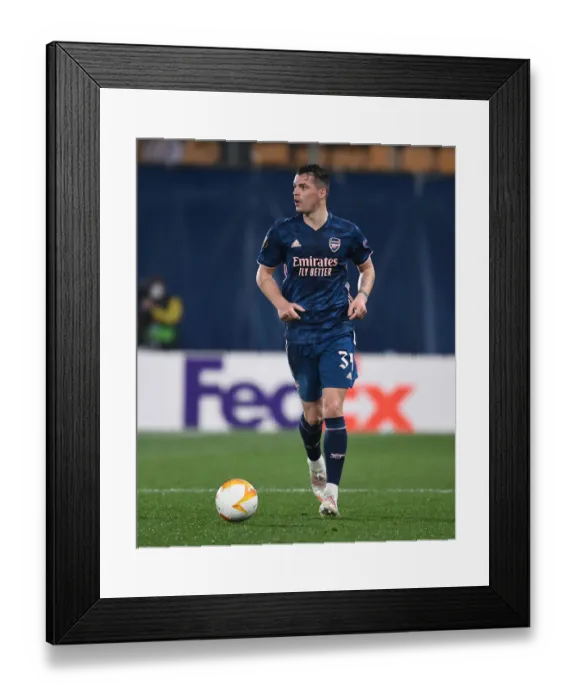 Framed Print : Granit Xhaka at Empty Estadio de la Ceramica: Arsenal's UEFA Europa League Semi-Final Showdown with Villarreal Amidst Coronavirus Restrictions