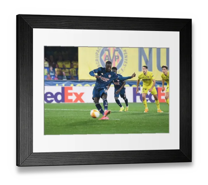 Framed Print : Nicolas Pepe Scores Penalty as Arsenal Take Early Lead in Europa League Semi-Final vs Villarreal