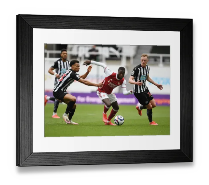 Framed Print : Pepe Faces Off Against Murphy and Longstaff: Newcastle vs. Arsenal in Empty St. James Park (2020-21)
