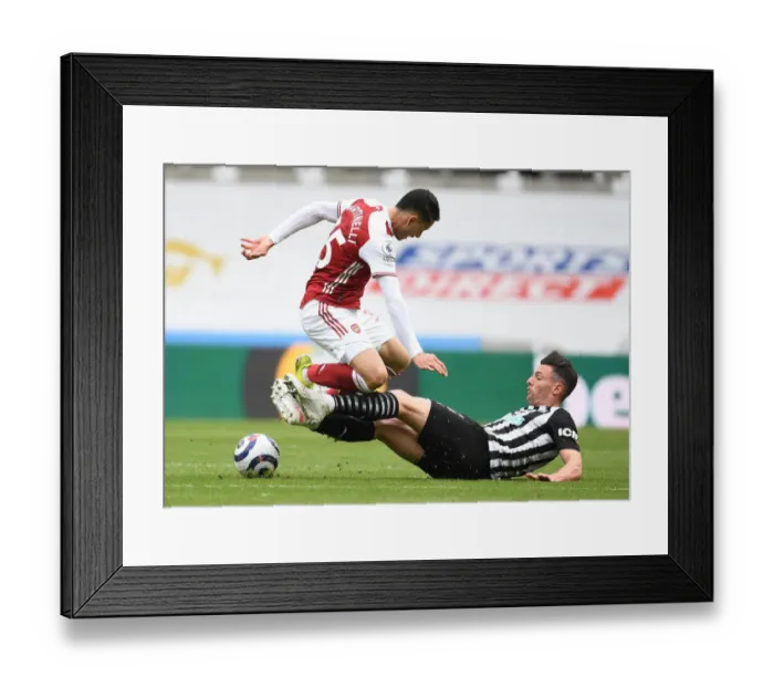 Framed Print : Arsenal vs. Newcastle United: A COVID-19 Restricted Clash in the Premier League - Martinelli vs. Schar at Empty St. James Park Framed Print : Arsenal vs. Newcastle United: A COVID-19 Restricted Clash in the Premier League - Martinelli vs. Schar at Empty St. James Park