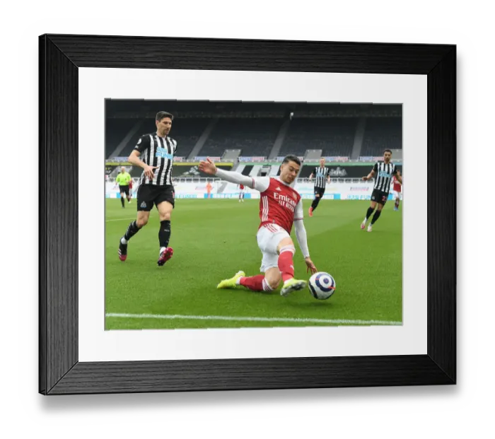 Framed Print : Martinelli's Radiant Performance: Arsenal Triumphs Over Empty Newcastle Stadium