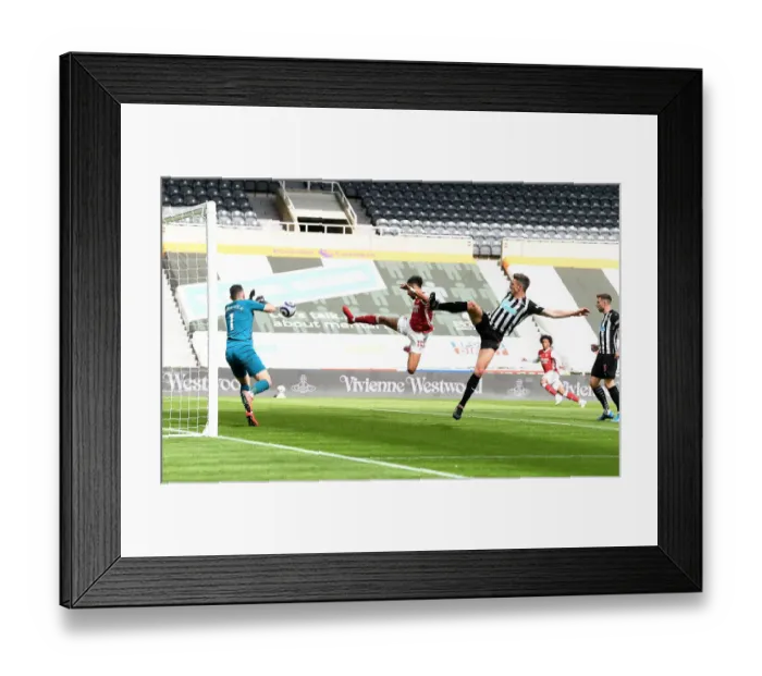 Framed Print : Arsenal's Aubameyang Scores in Empty St. James Park: Arsenal Triumph Over Newcastle in the 2021-22 Premier League