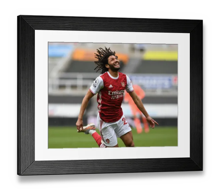 Framed Print : Mohamed Elneny Scores the Winning Goal: Arsenal Secures Victory over Newcastle in Empty St. James Park (2020-21)