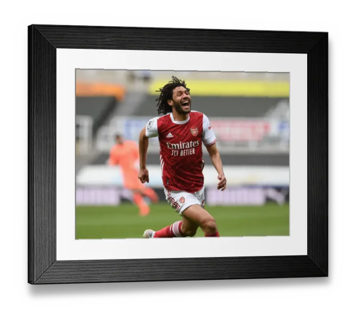 Framed Print : Mohamed Elneny Scores the Winning Goal: Arsenal Secures Victory Over Newcastle in Empty St. James Park