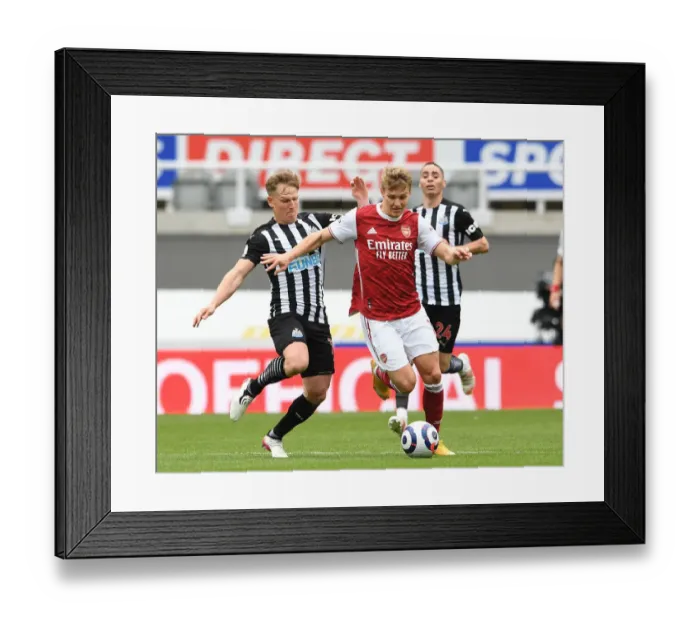 Framed Print : Arsenal's Martin Odegaard Faces Off Against Newcastle's Matt Ritchie in Empty St. James Park - Premier League Clash 2021