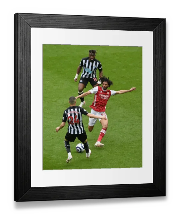 Framed Print : Elneny vs Almiron: A Battle at St. James Park in Empty Stands - Newcastle United vs Arsenal, Premier League 2020-21
