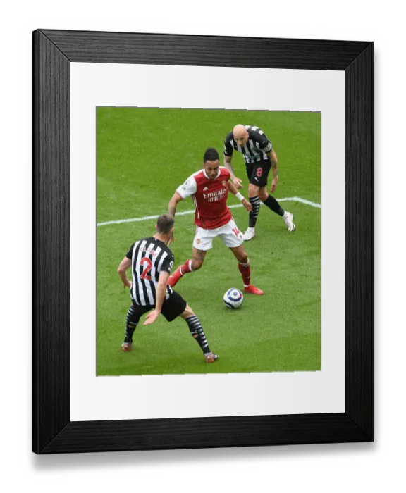 Framed Print : Aubameyang Faces Newcastle Duo in Empty St. James Park: Arsenal vs Newcastle United, Premier League 2020-21 Framed Print : Aubameyang Faces Newcastle Duo in Empty St. James Park: Arsenal vs Newcastle United, Premier League 2020-21
