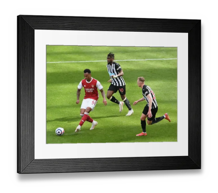 Framed Print : Gabriel Magalhaes Faces Pressure from Allan Saint-Maximin and Sean Longstaff in Newcastle United vs Arsenal Premier League Clash (2021)
