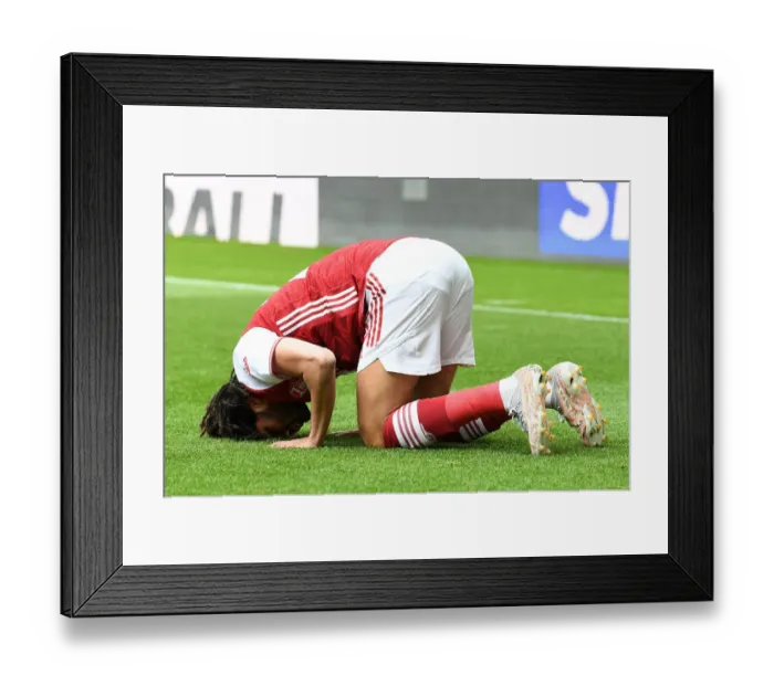 Framed Print : Mohamed Elneny Scores the Winning Goal: Arsenal Secures Victory Over Newcastle in Empty St. James Park