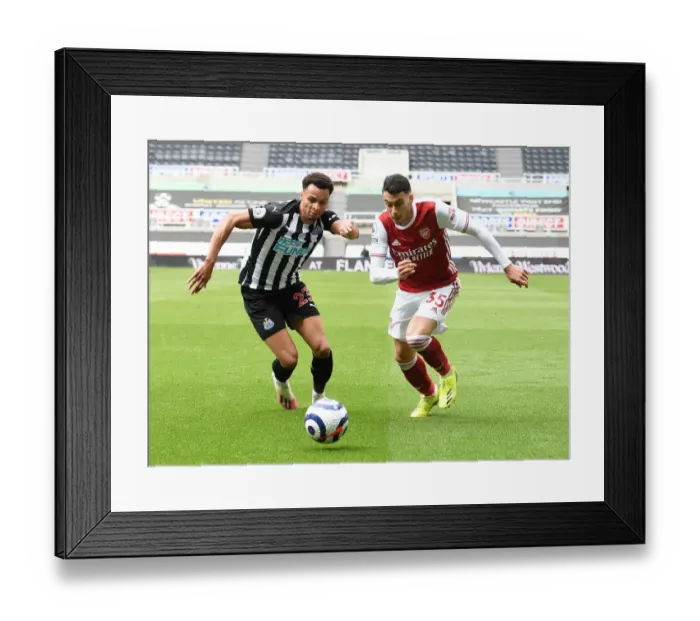 Framed Print : Gabriel Martinelli Clashes with Jacob Murphy: Newcastle vs. Arsenal, Premier League 2021 (Behind Closed Doors)