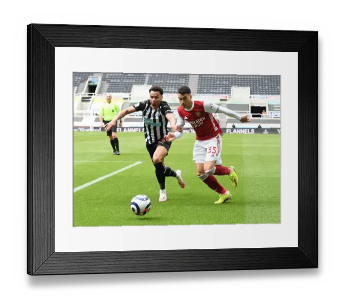 Framed Print : Behind Closed Doors: Martinelli vs. Murphy Clash - Arsenal's Battle at Newcastle, Premier League 2021
