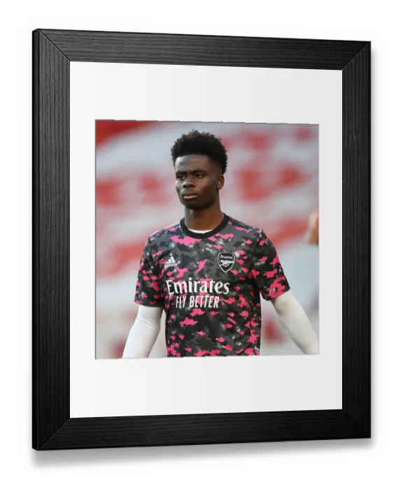 Framed Print : Bukayo Saka Prepares for Europa League Semi-Final Against Villarreal at Empty Emirates Stadium