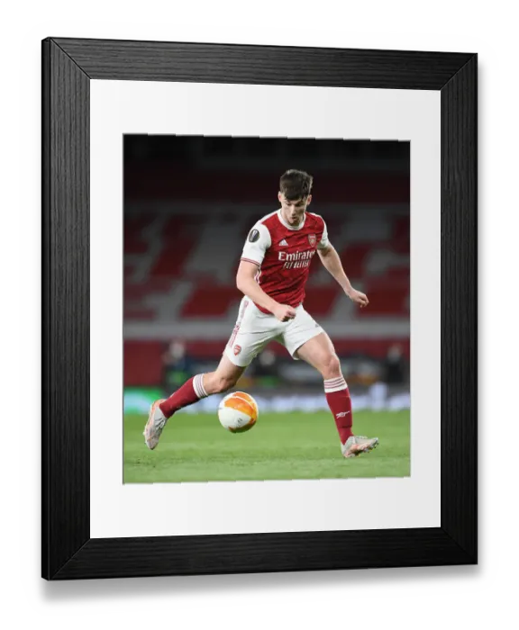 Framed Print : Arsenal's Kieran Tierney in Action at Empty Emirates Stadium: Europa League Semi-Final vs Villarreal