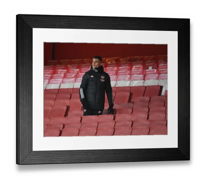 Framed Print : Lone Warrior Xhaka: Arsenal's Battle in Empty Emirates Stadium - UEFA Europa League Semi-Final