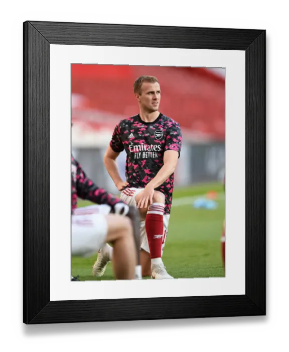 Framed Print : Arsenal's Rob Holding Before Empty Emirates Stadium in UEFA Europa League Semi-Final vs Villarreal CF Framed Print : Arsenal's Rob Holding Before Empty Emirates Stadium in UEFA Europa League Semi-Final vs Villarreal CF