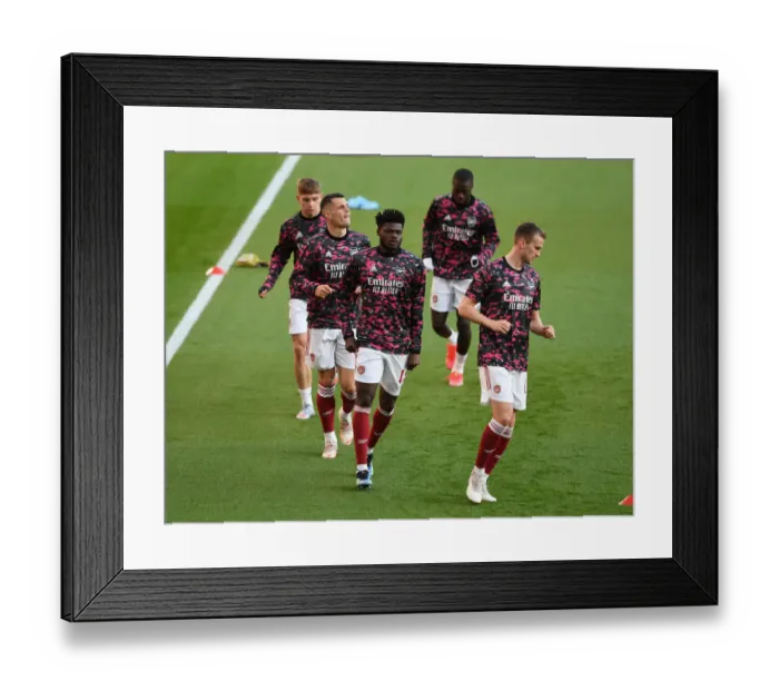 Framed Print : Thomas Partey's Silent Battle: Arsenal's Europa League Semi-Final Showdown vs Villarreal CF at Empty Emirates Framed Print : Thomas Partey's Silent Battle: Arsenal's Europa League Semi-Final Showdown vs Villarreal CF at Empty Emirates