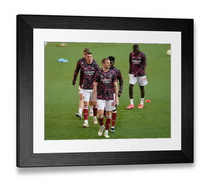 Framed Print : Arsenal's Rob Holding: Pre-Match Focus at Empty Emirates Stadium in UEFA Europa League Semi-Final vs Villarreal CF