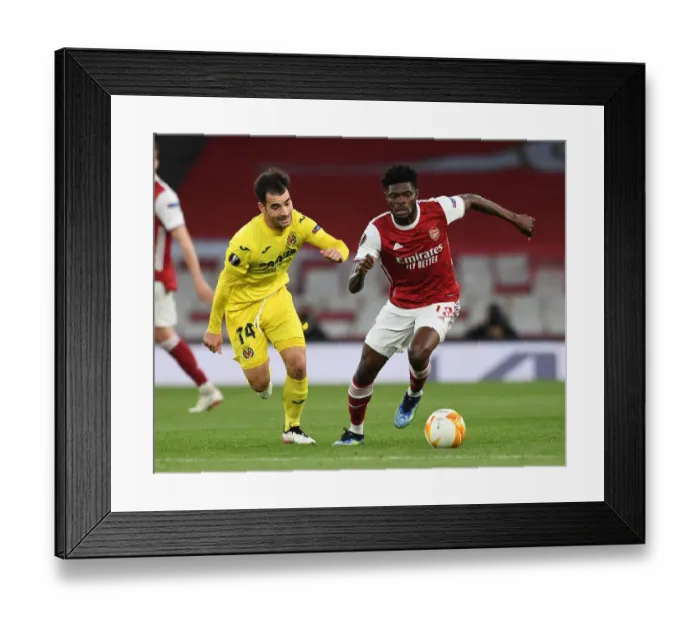 Framed Print : Thomas Partey's Battle: Arsenal vs. Villarreal - UEFA Europa League Semi-Final at Emirates Stadium