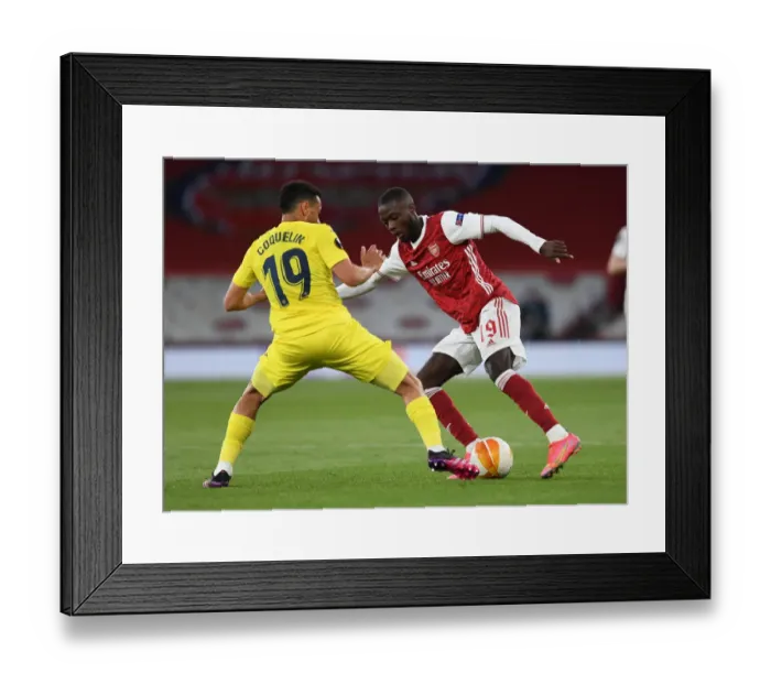 Framed Print : Pepe vs. Coquelin: A Europa League Showdown in Empty Emirates Stadium - Arsenal vs. Villarreal
