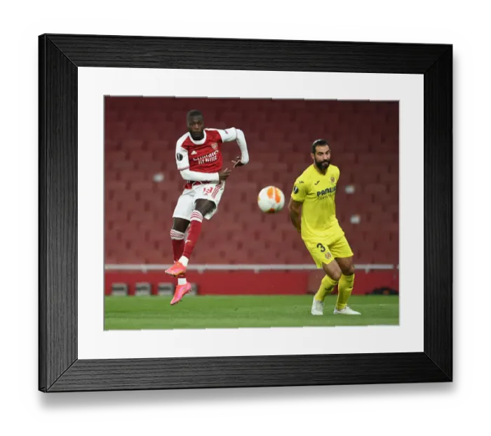 Framed Print : Arsenal vs Villarreal: Pepe Shoots Under Pressure in Empty Europa League Semi-Final Framed Print : Arsenal vs Villarreal: Pepe Shoots Under Pressure in Empty Europa League Semi-Final