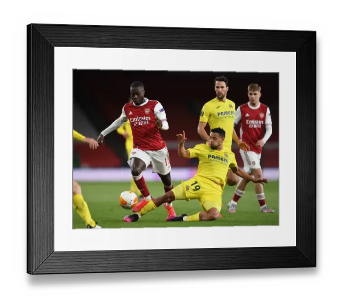Framed Print : Pepe vs. Coquelin: A Riveting Rivalry in Empty Emirates Stadium - Arsenal vs. Villarreal UEFA Europa League Semi-Final Clash