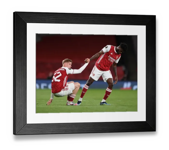 Framed Print : Arsenal's Thomas Partey Consoles Emile Smith Rowe after Europa League Semi-Final Match vs Villarreal Framed Print : Arsenal's Thomas Partey Consoles Emile Smith Rowe after Europa League Semi-Final Match vs Villarreal