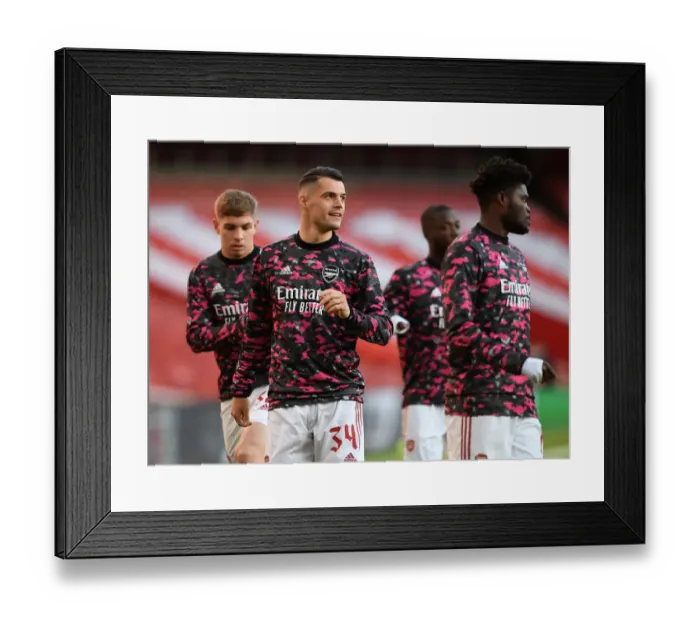 Framed Print : Granit Xhaka's Pre-Match Focus at Empty Emirates Stadium: Arsenal's UEFA Europa League Semi-Final Showdown with Villarreal CF Framed Print : Granit Xhaka's Pre-Match Focus at Empty Emirates Stadium: Arsenal's UEFA Europa League Semi-Final Showdown with Villarreal CF