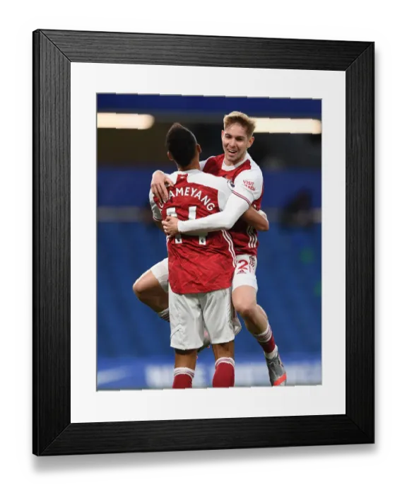 Framed Print : Smith Rowe and Aubameyang: Arsenal's Unstoppable Duo Celebrate Goal Against Chelsea in Empty Stamford Bridge