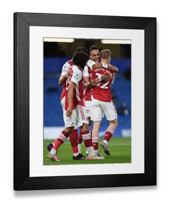 Framed Print : Unstoppable Arsenal: Smith Rowe and Aubameyang's Goal Celebration at Empty Stamford Bridge