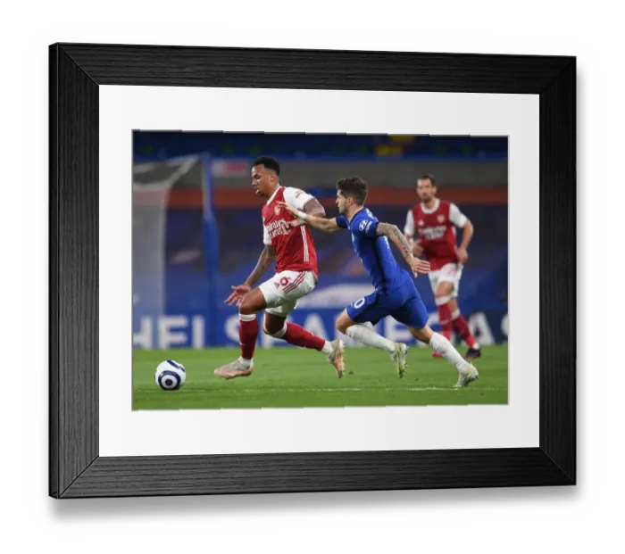 Framed Print : Gabriel Magalhaes vs. Christian Pulisic: A Battle at Stamford Bridge in the Empty Premier League