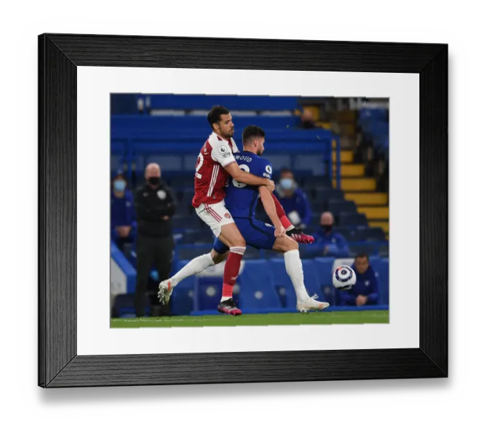 Framed Print : Pablo Mari vs. Olivier Giroud: A Rivalry Renewed in Empty Stamford Bridge - Chelsea vs. Arsenal, Premier League 2020-21