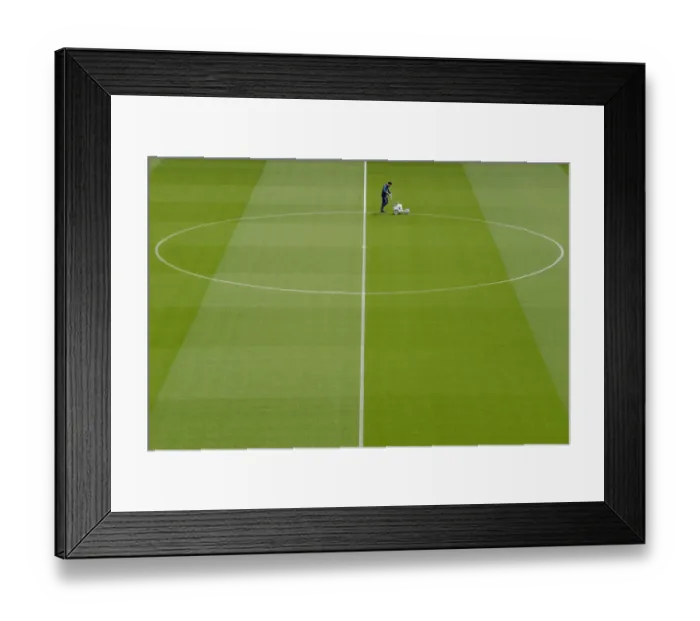 Framed Print : Arsenal's Groundsman Prepares Emirates Turf for Arsenal vs Brighton & Hove Albion