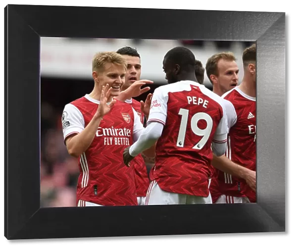 Arsenal Celebrate with Pepe and Odegaard: Arsenal v Brighton & Hove Albion, Premier League 2021
