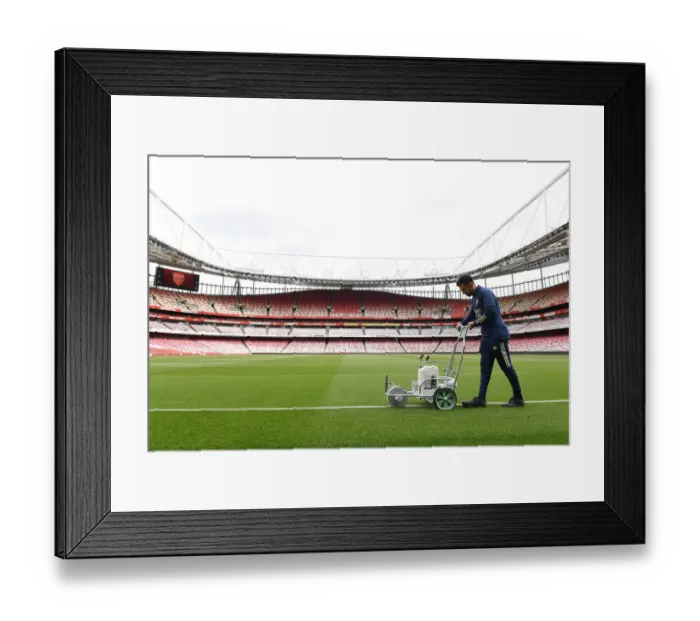Framed Print : Preparing the Emirates Turf: Arsenal's Groundsman Readies the Pitch for Arsenal vs Brighton & Hove Albion Framed Print : Preparing the Emirates Turf: Arsenal's Groundsman Readies the Pitch for Arsenal vs Brighton & Hove Albion